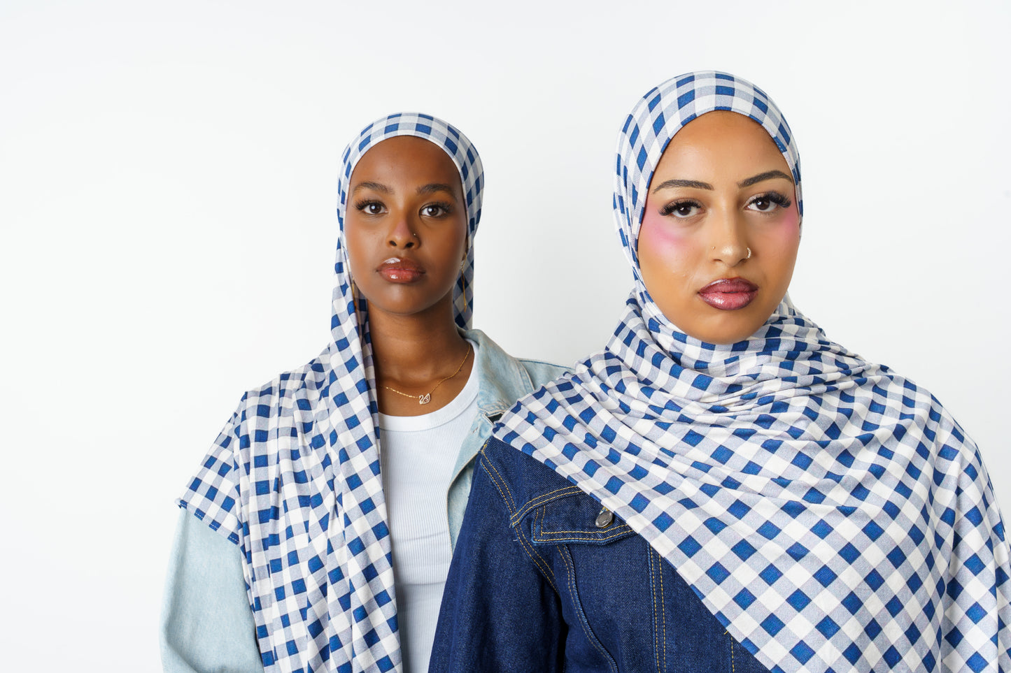 Two women wearing Picnic Club printed jersey hijabs