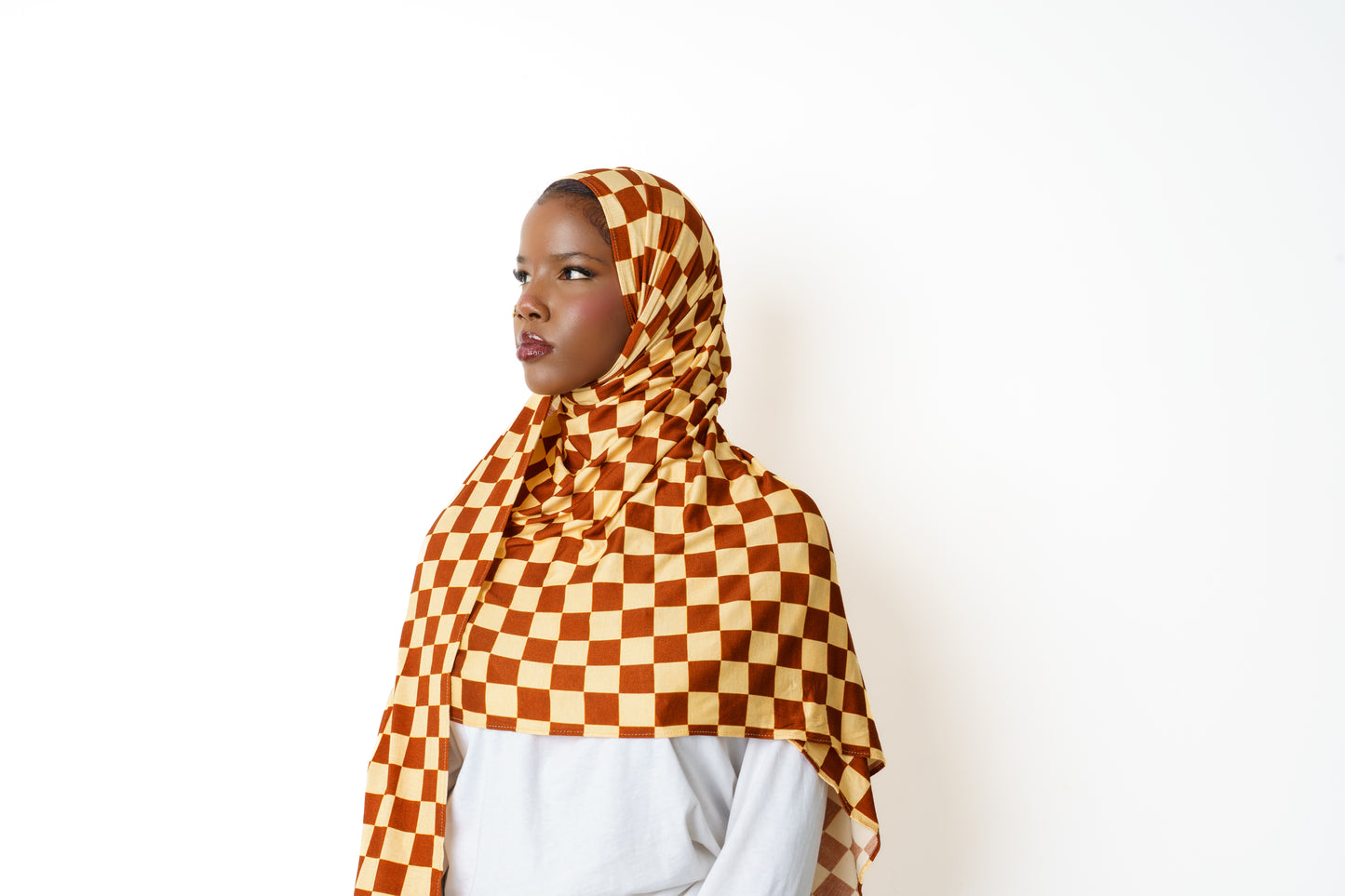 Woman wearing Checkmate printed jersey hijab